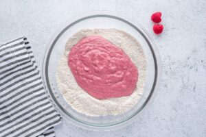 Dry and liquid ingredients for superhero muffin in a bowl
