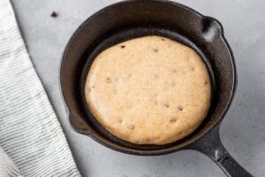Pancake in pan ready to be baked