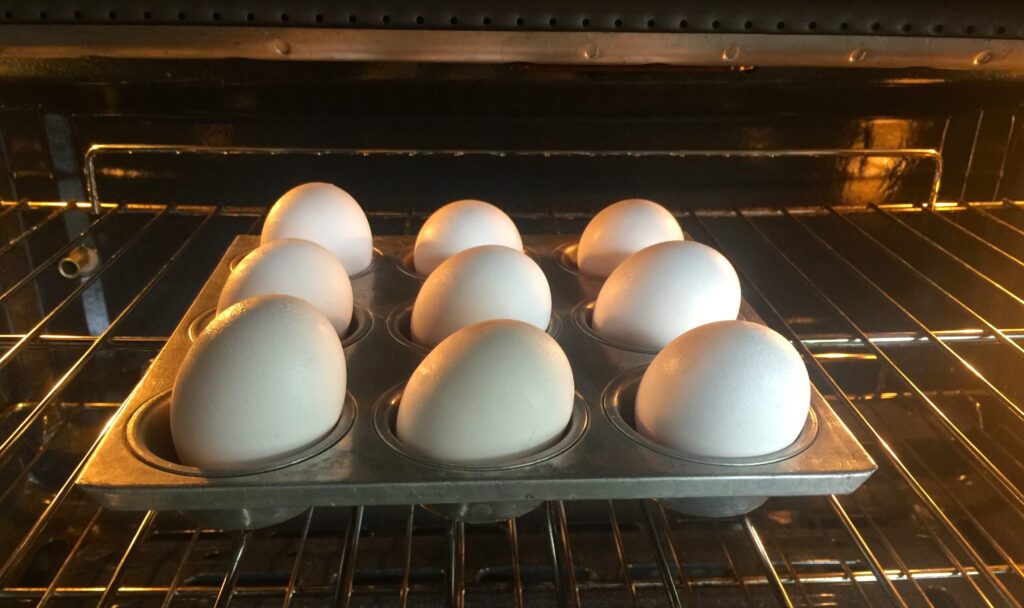 8 eggs in a muffin tin baking in the oven