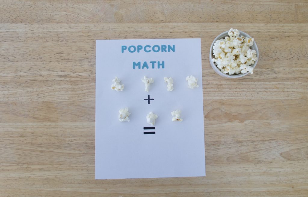 popcorn kernels on sheet of paper for hands on math learning