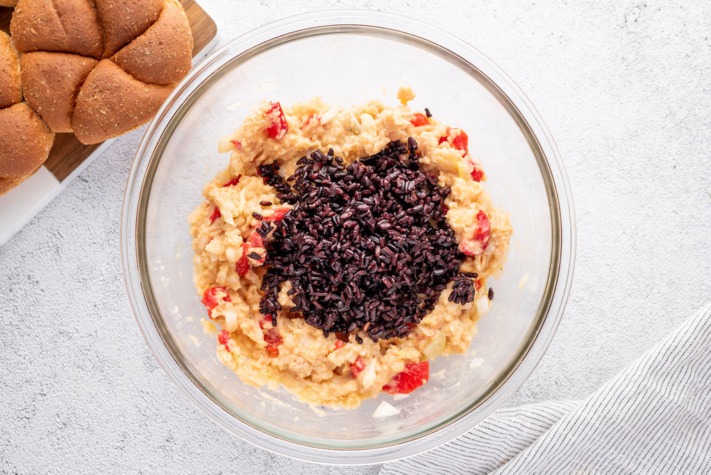 bean and black rice mixture with roast red peppers in a glass bowl