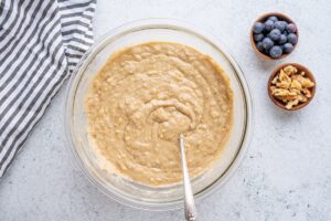 Dough for Oat Banana Blueberry Muffins In a Bowl