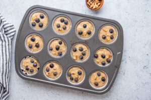 Oat Banana Blueberry Muffins in Muffin Pan Ready to Bake