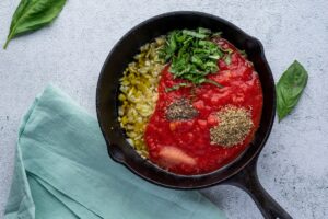 Skillet with sauce ingredients for Keto Vegetarian Lasagna