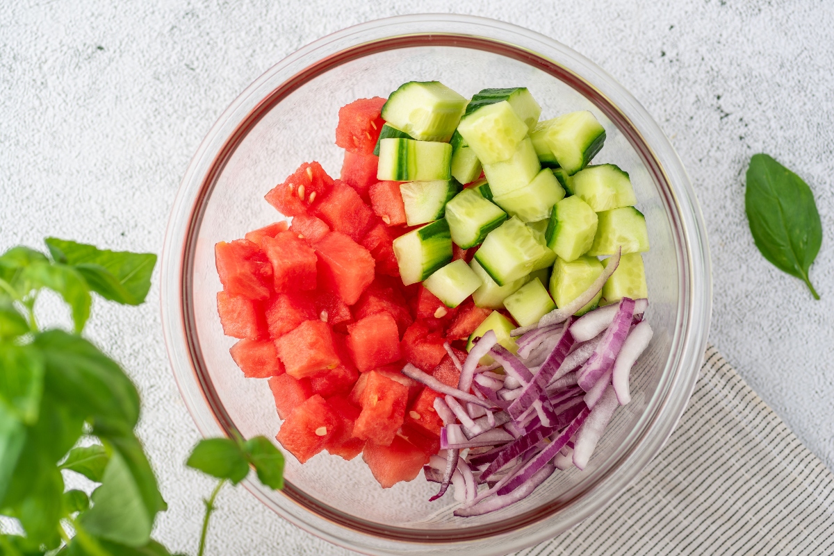 Watermelon, cucumber and onion in a bowl for Watermelon Salad with Coconut Rice
