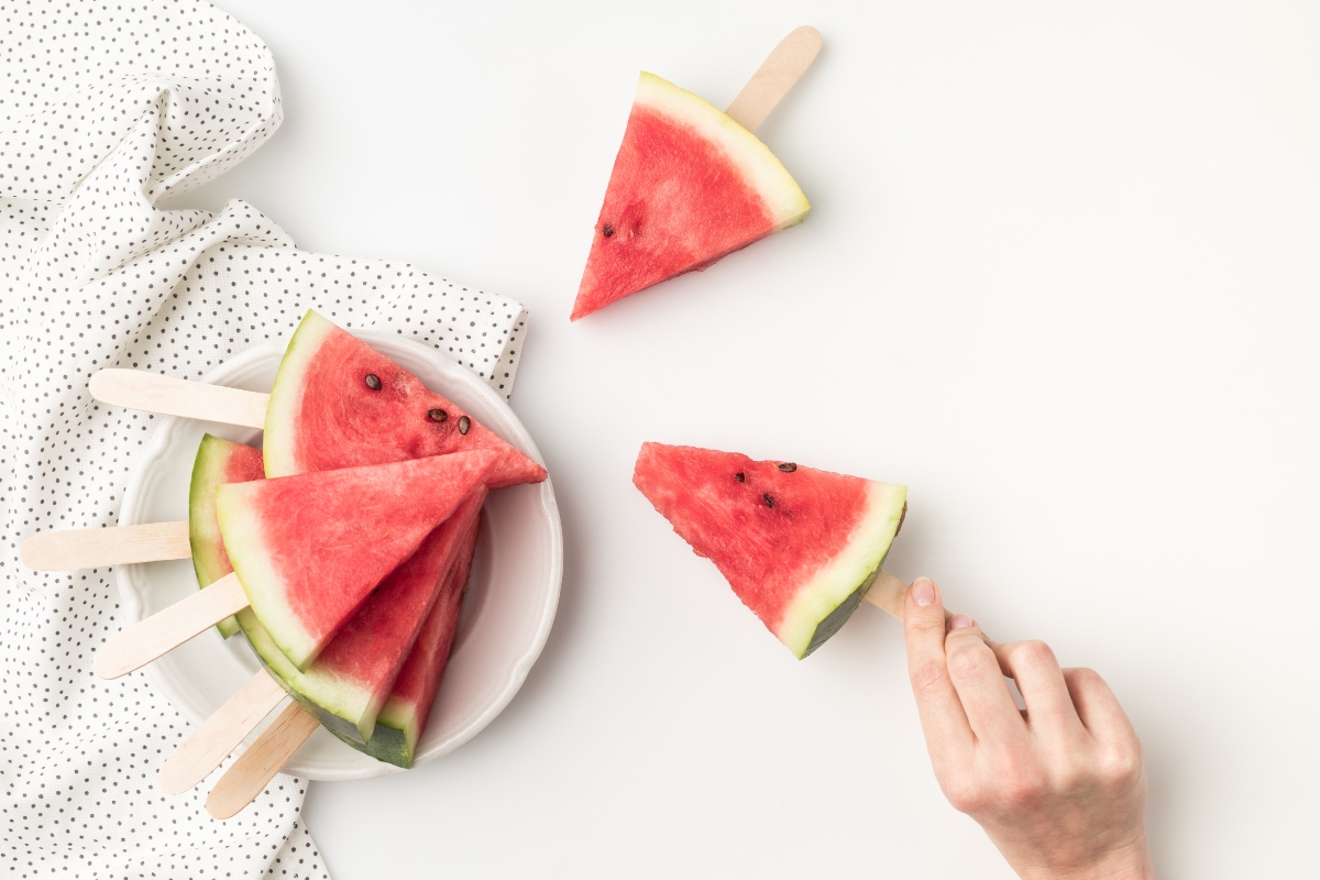 Watermelon pieces as popsicles