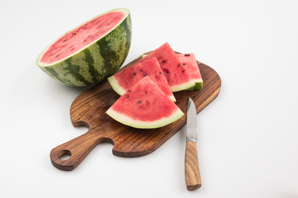 Watermelon sliced on a cutting board