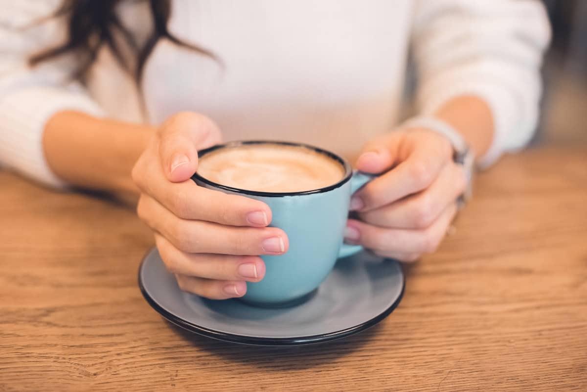Woman holding a cup of coffee