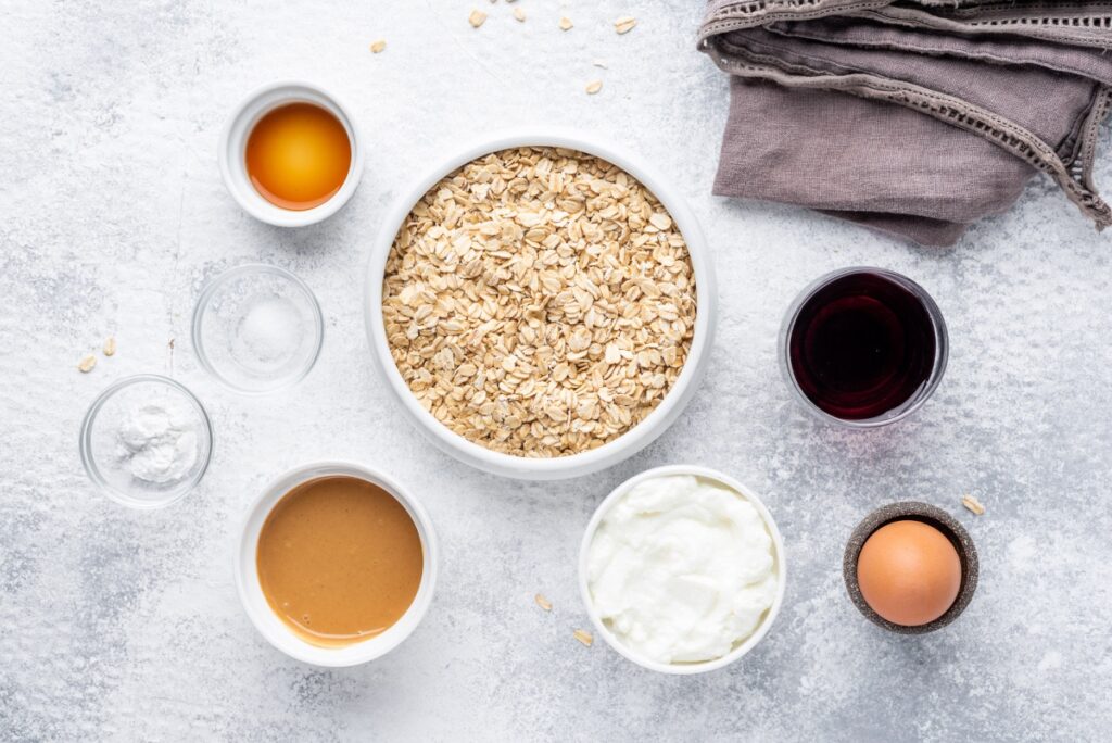 Food ingredients for peanut butter pancakes with jelly in bowls