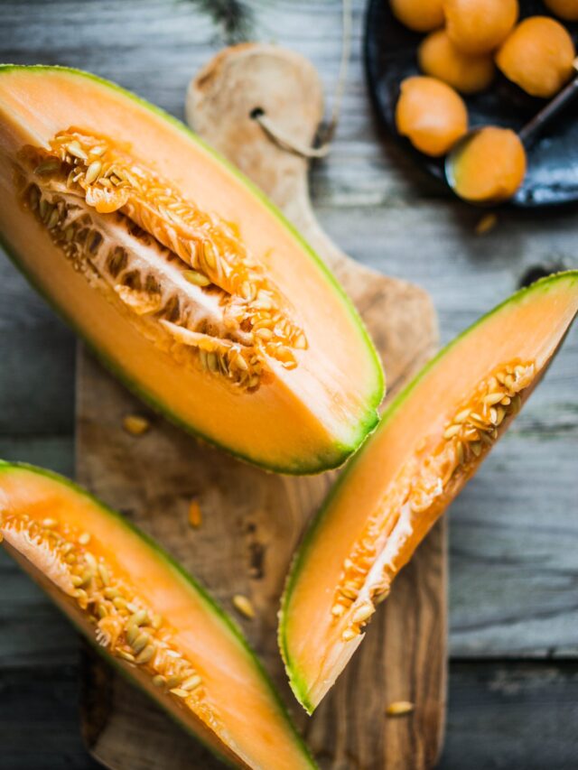 Pieces of melon on cutting board