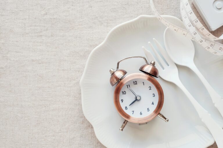 A clock on the plate and tape measure