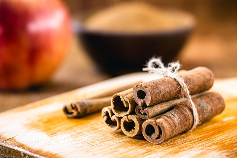 Cinnamon sticks on a cutting board