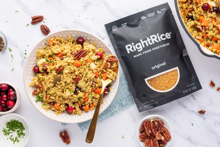 Thanksgiving rice in a bowl with a spoon and a package of RightRice beside