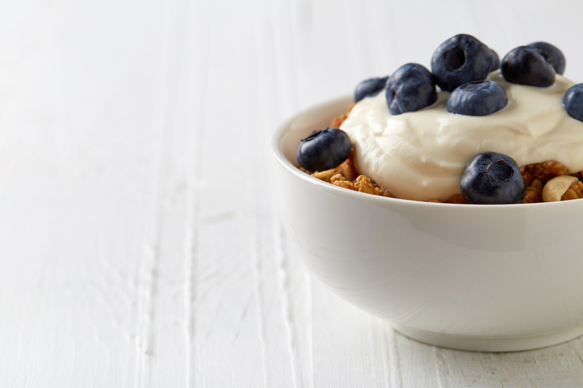 Yogurt in a cup with blueberries and corn flex