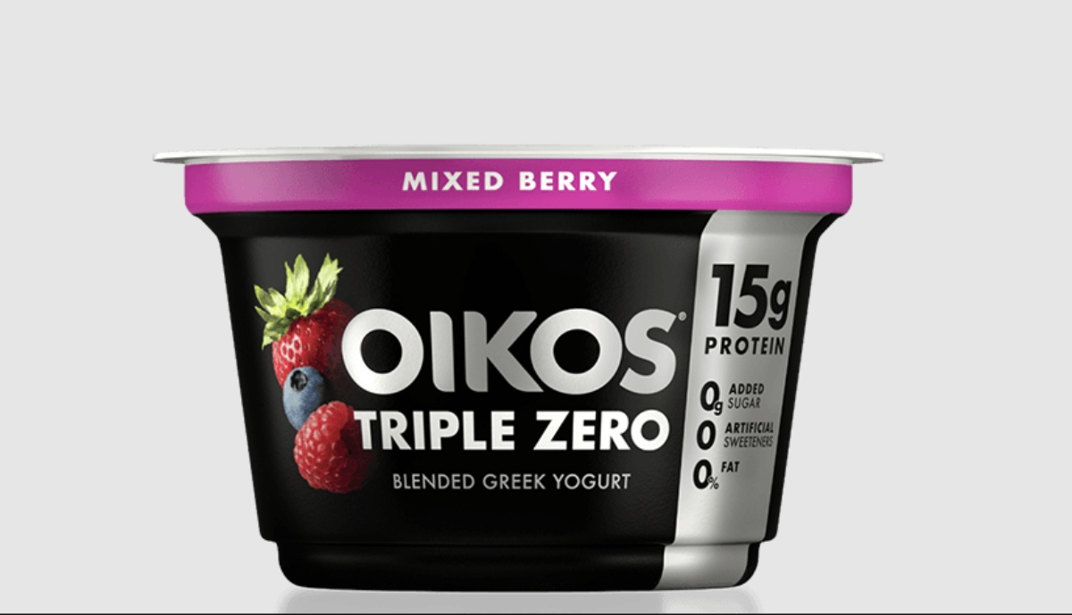 Oikos triple zero Greek yogurt on against the light grey background
