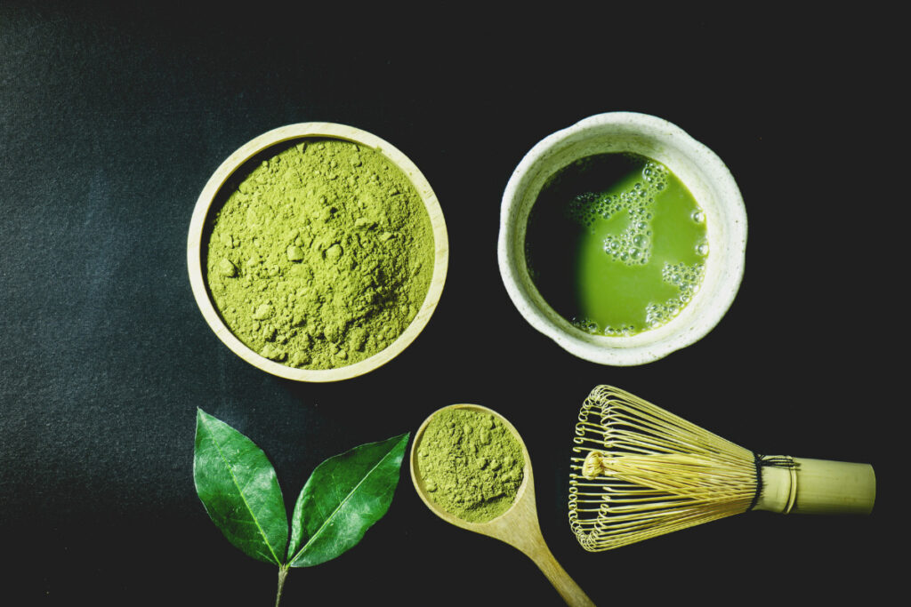 Matcha powder and ready to drink tea in two cups