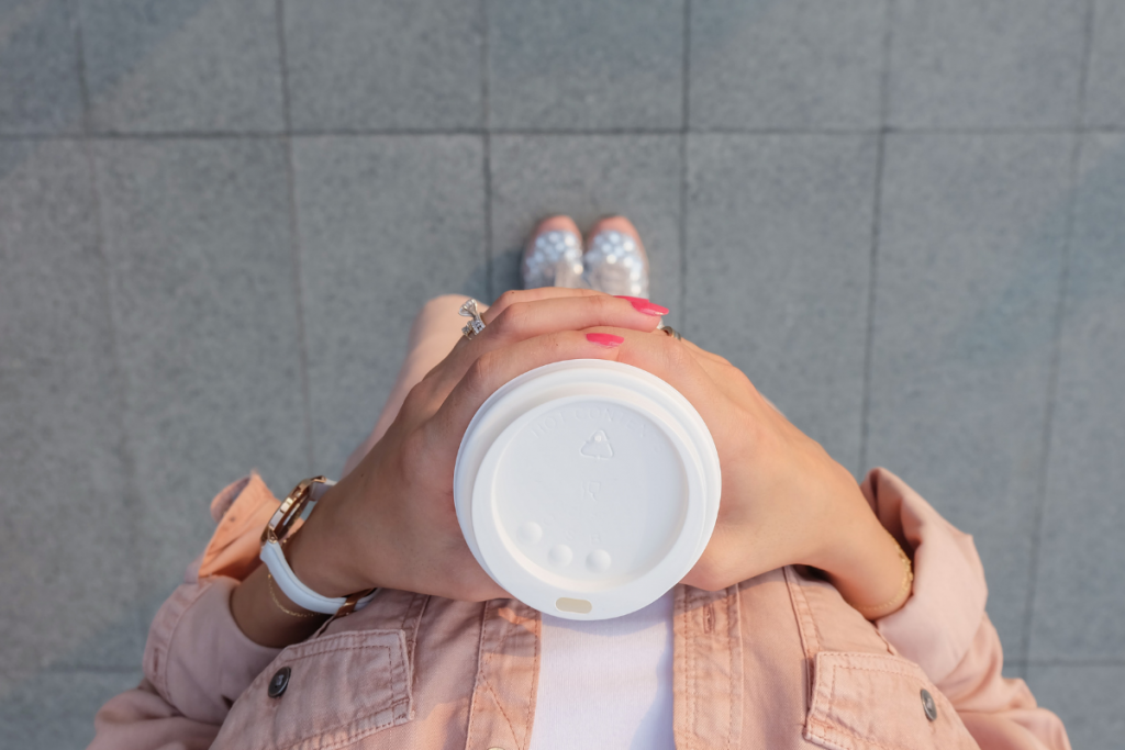 A woman holding a coffee cup