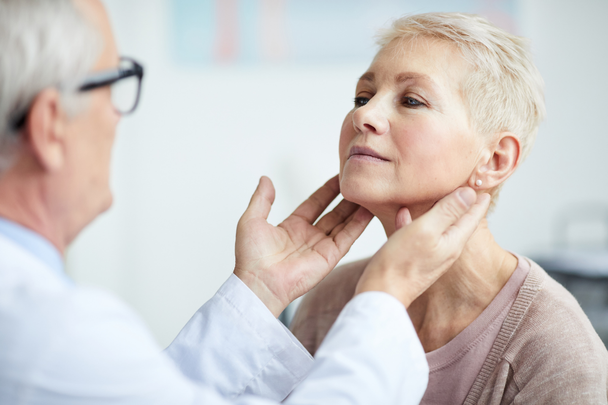 Endocrinologist examining a patient