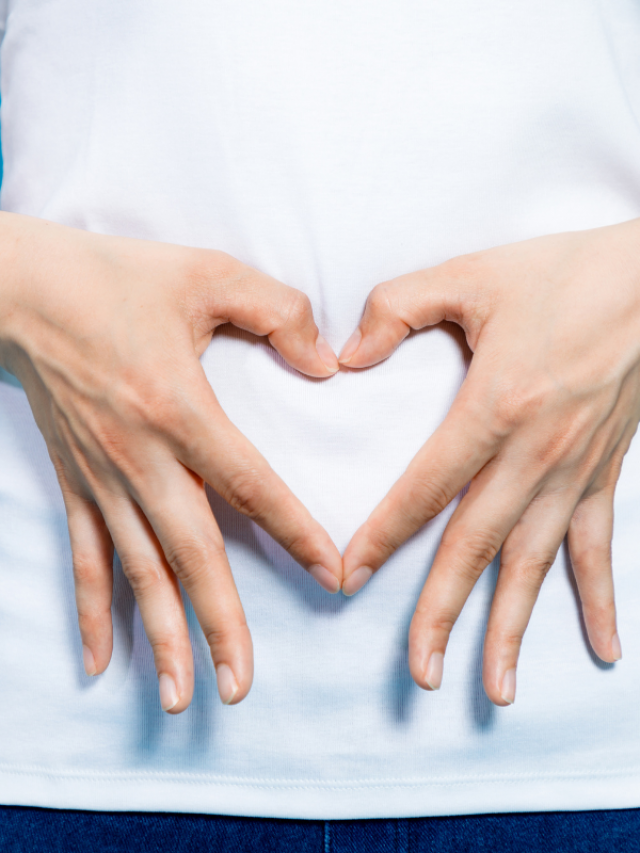 cropped-A-woman-forming-a-heart-with-her-hand-on-her-stomach.png