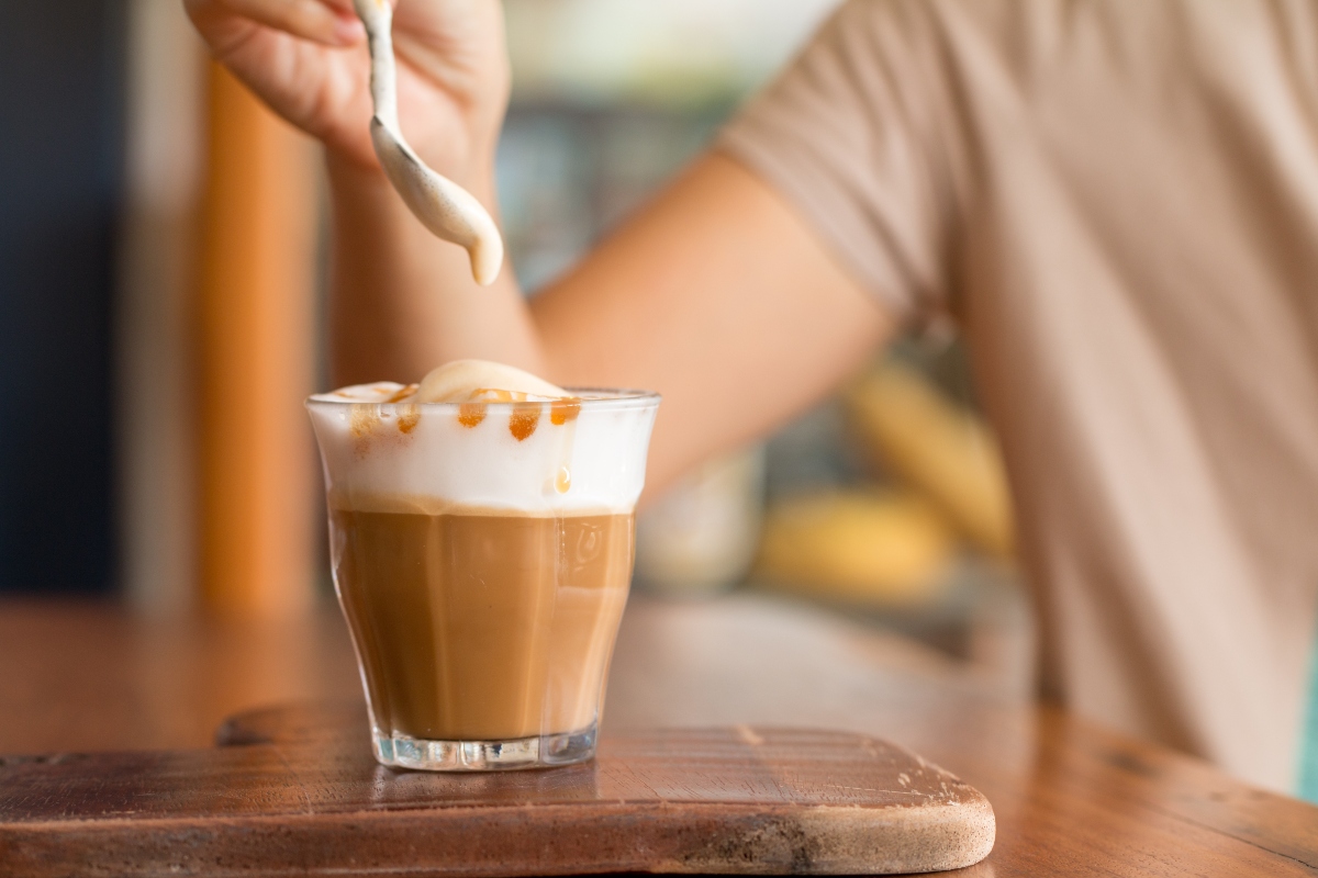 Latte macchiato coffee on a wooden table
