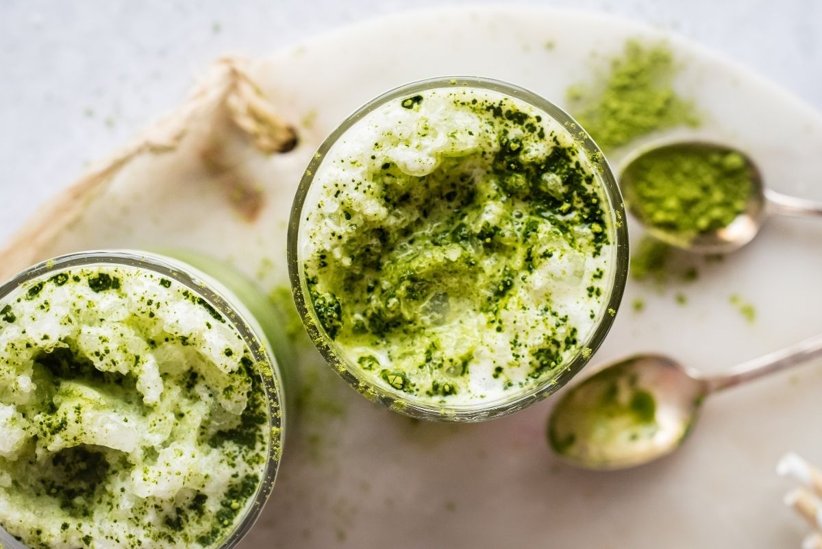Bird's view of two glasses of frozen matcha latte drink