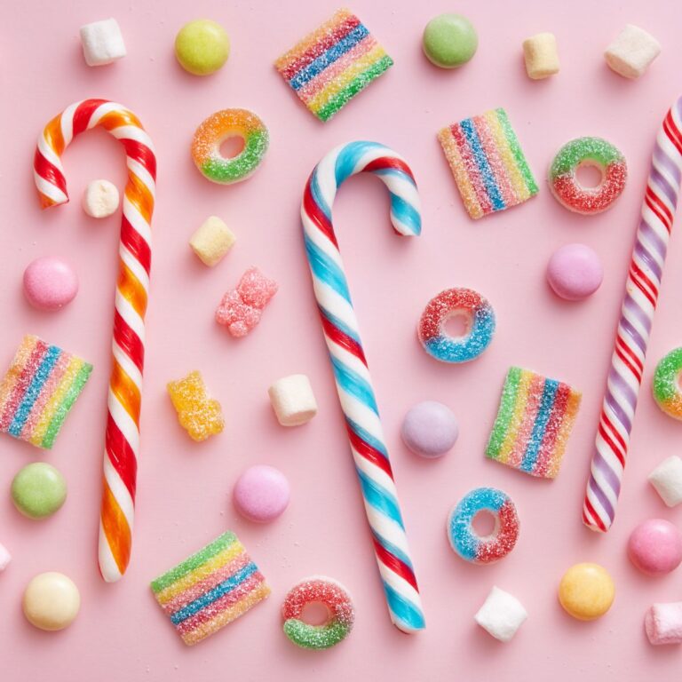 assorted candy on a pink background