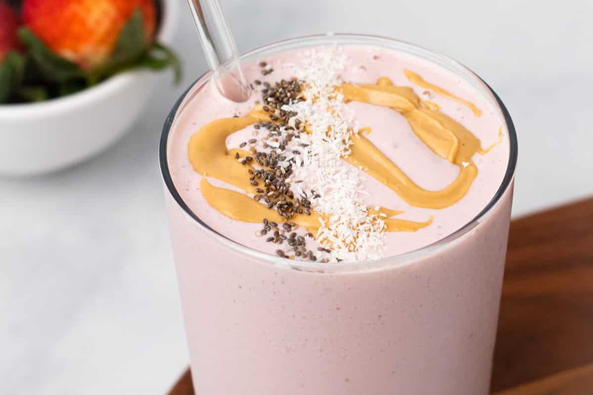 Tofu strawberry smoothie with peanut butter drizzle on top