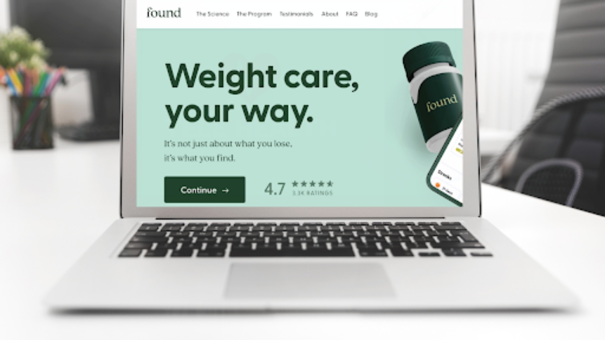 Found Weight Loss Program app on a gray laptop