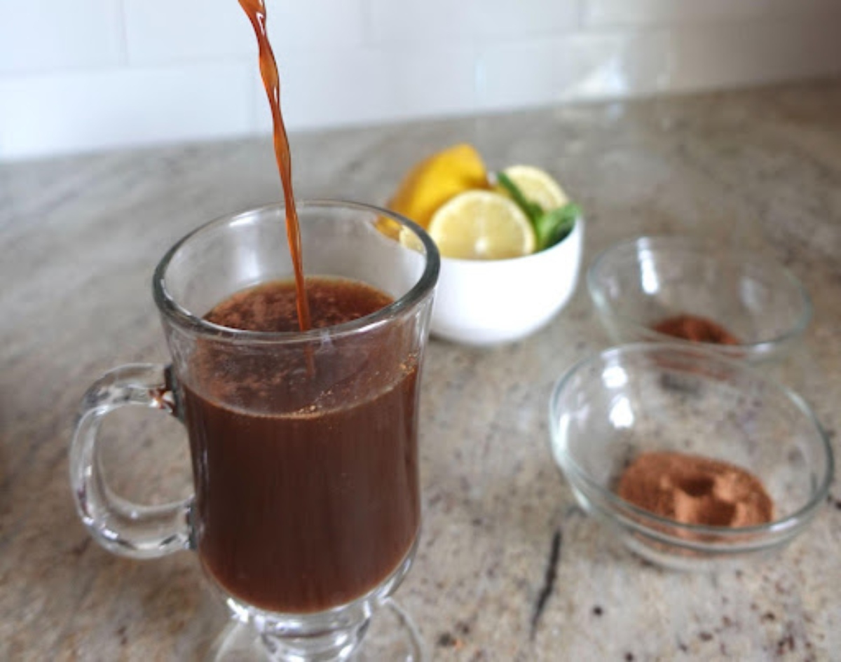 Pouring hot toddy in glass