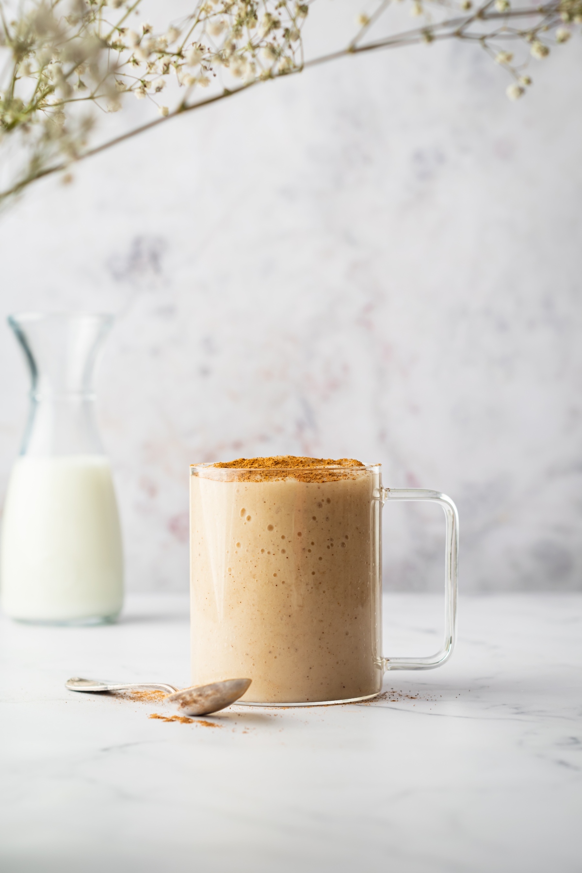 Sea moss drink in a mug topped with cinnamon
