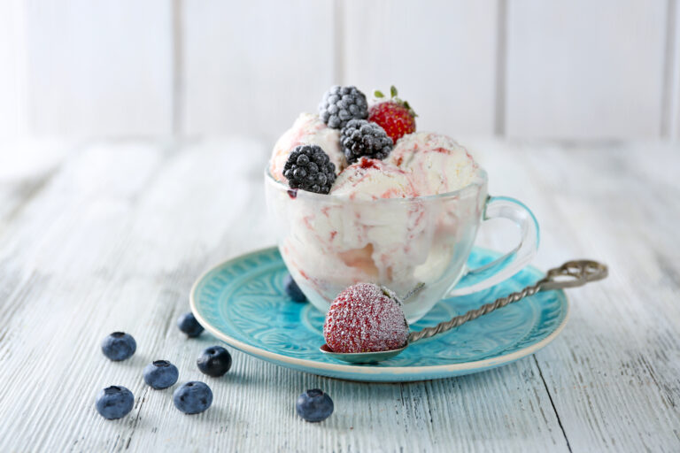 bowl of frozen cottage cheese ice cream topped with frozen berries