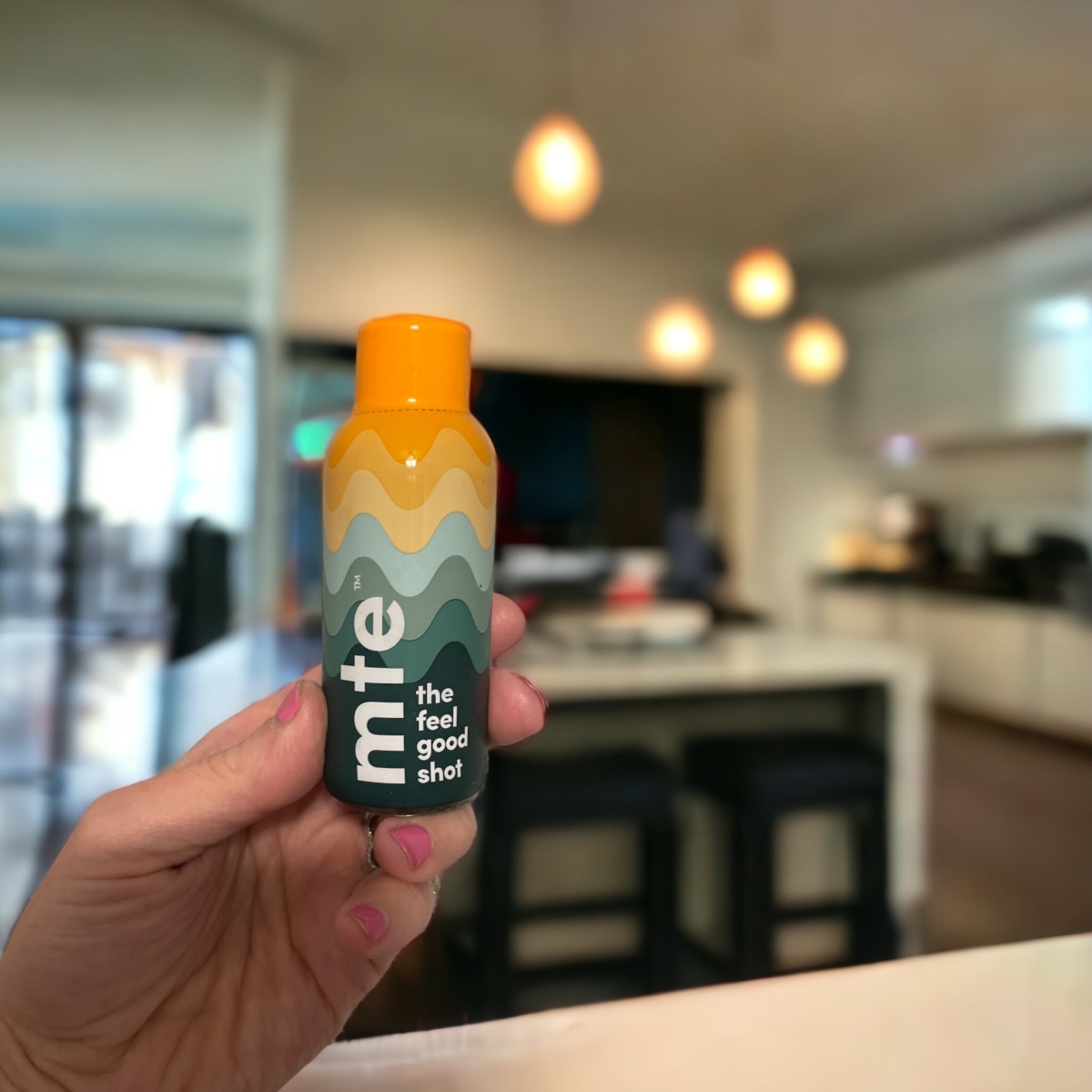 Person holding MTE bottle