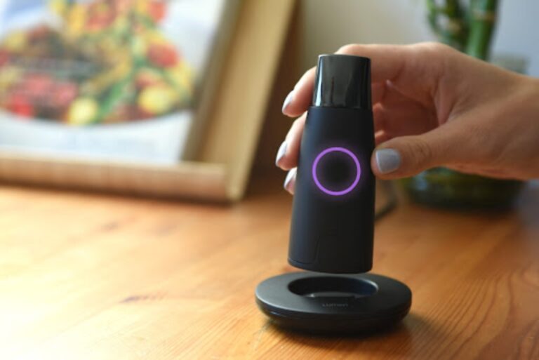 Woman holding Lumen metabolism tracker