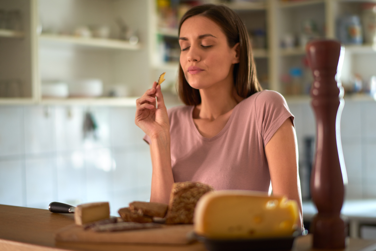Woman eating cheese
