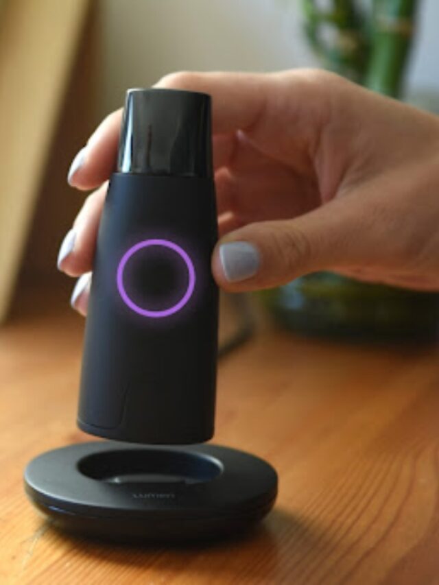 Woman holding Lumen metabolism tracker