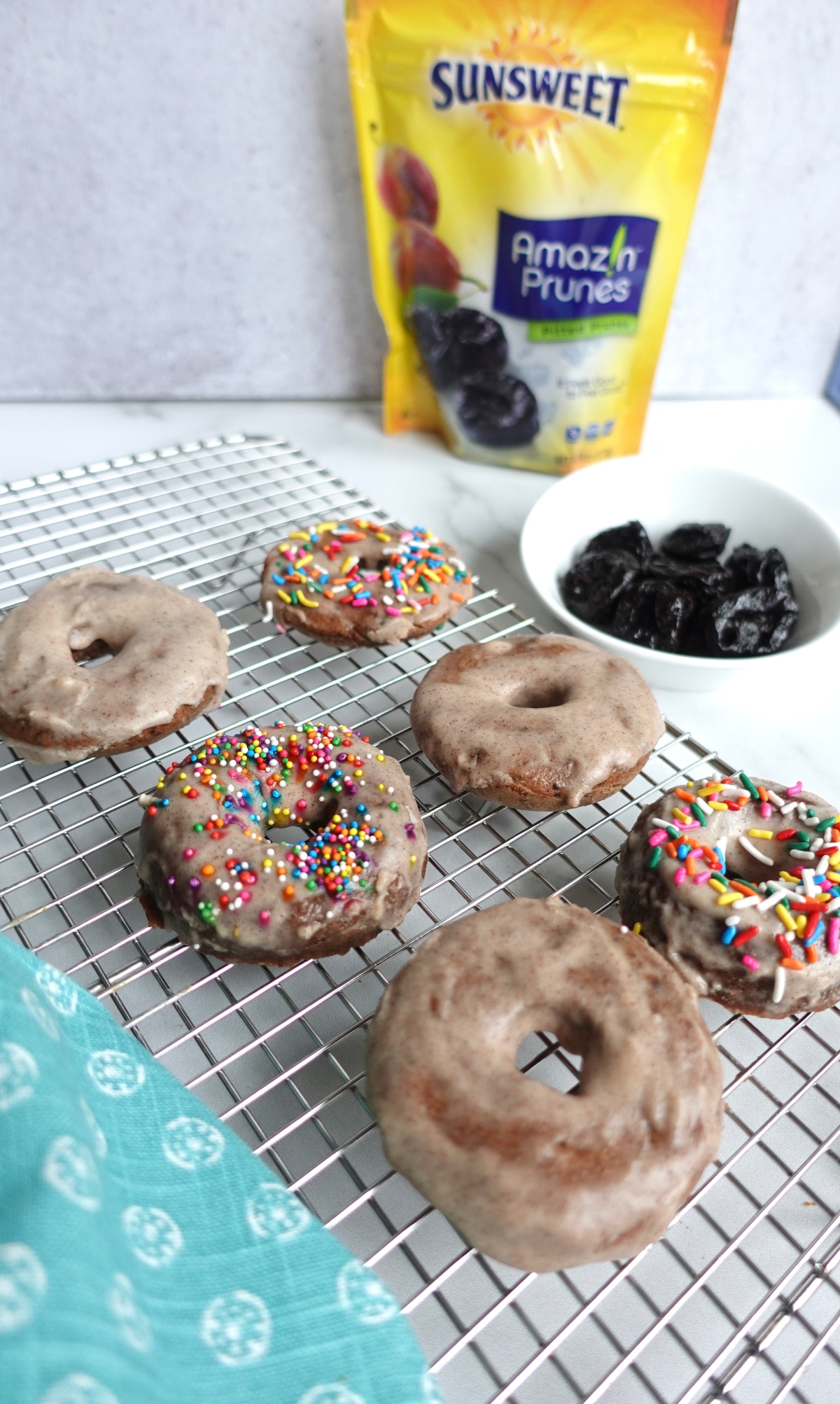 Apple prune donuts with pack of Sunsweet prunes in the background