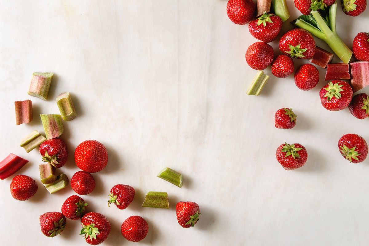 Rhubarb and strawberries against the white background