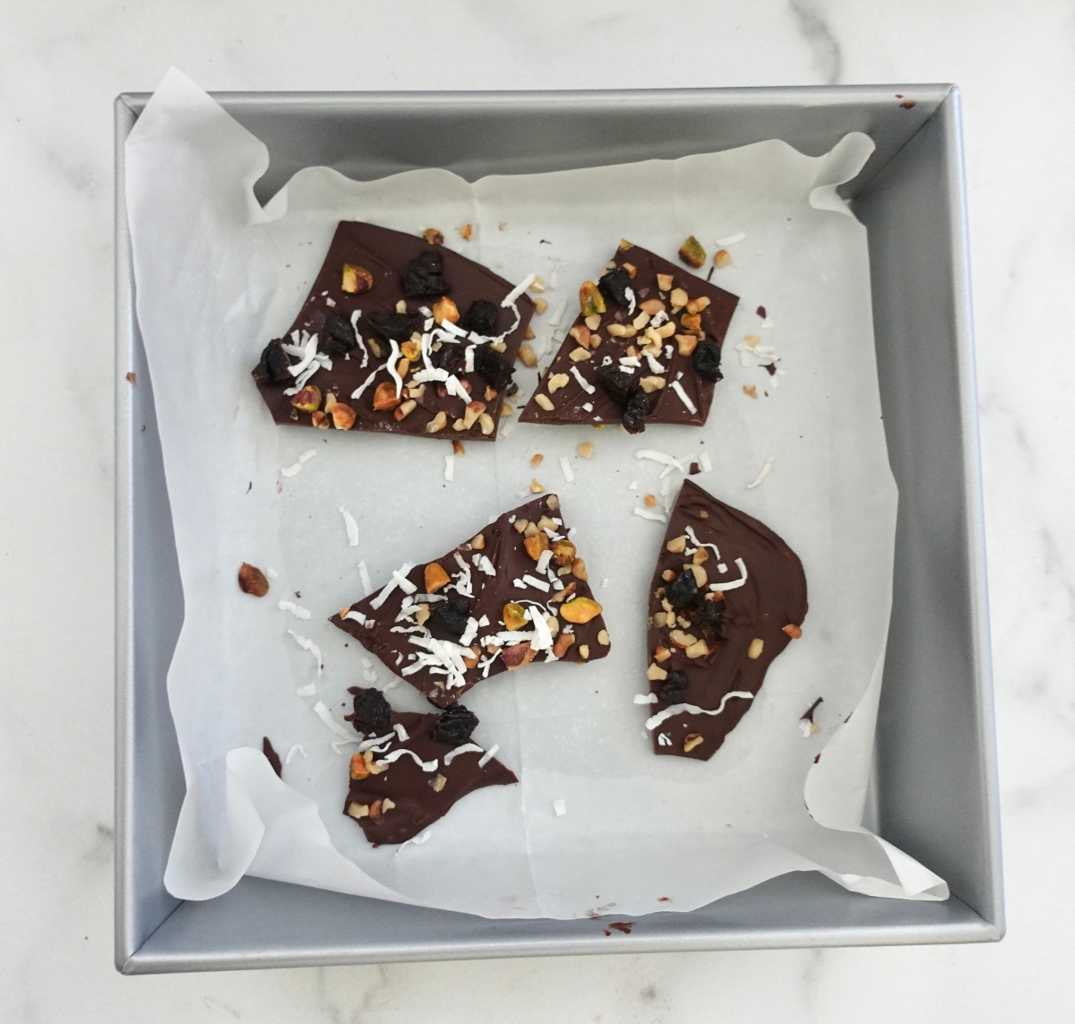 Low sugar chocolate bark with prunes and nuts