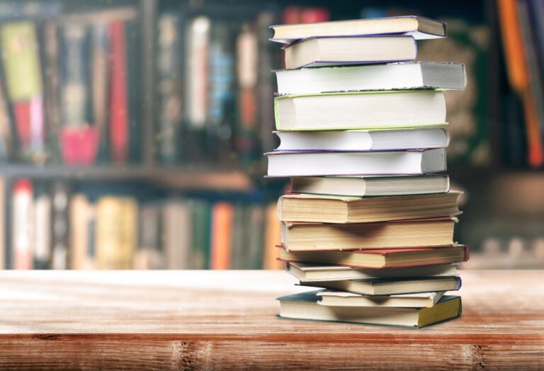 Diabetes books stacked on a table