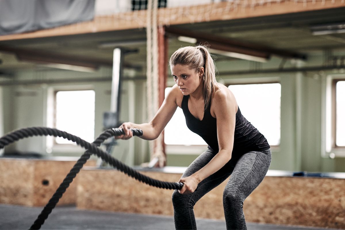 Woman Exercising with Ropes
