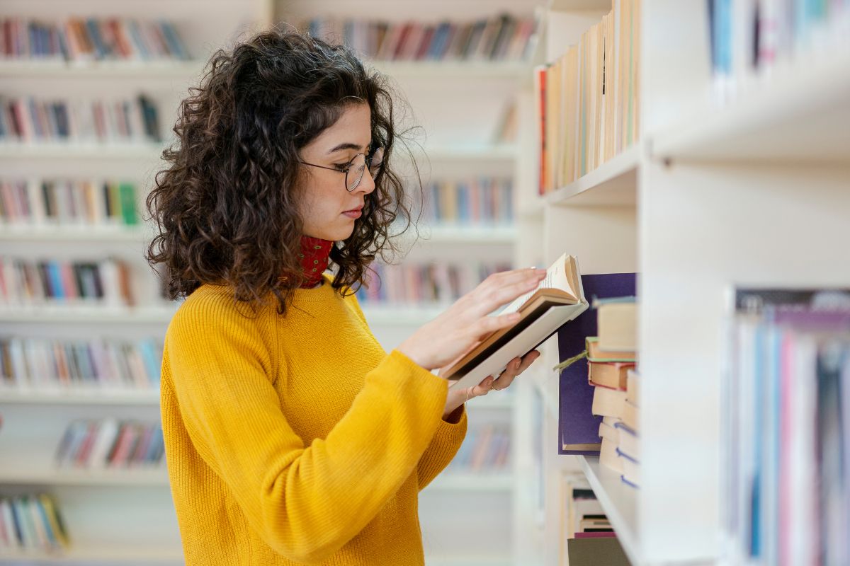 Woman reading a book in the bookstore