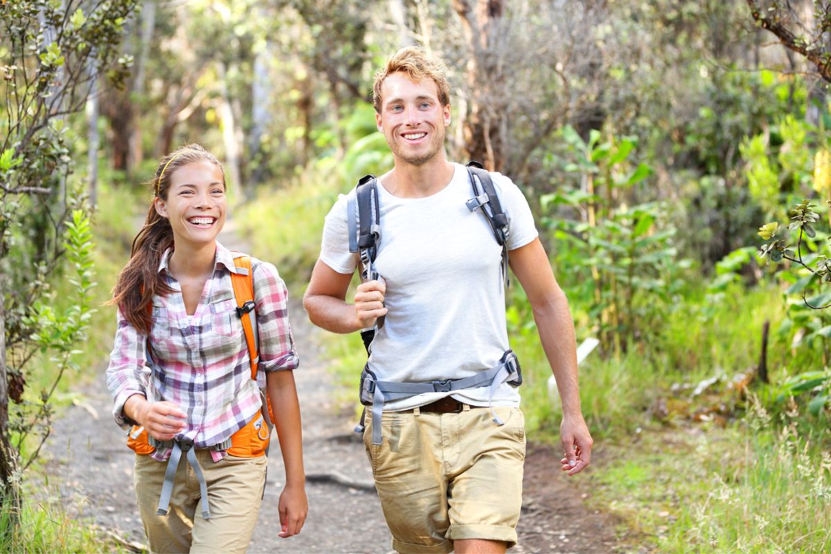Woman and man hiking in the woods