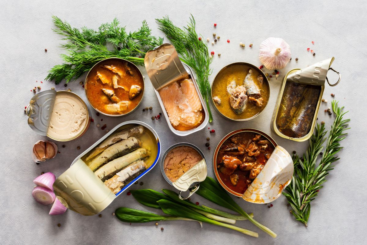 Open tin cans with canned fish