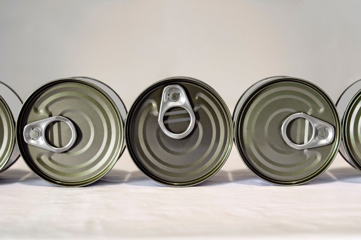 Tins on a white surface