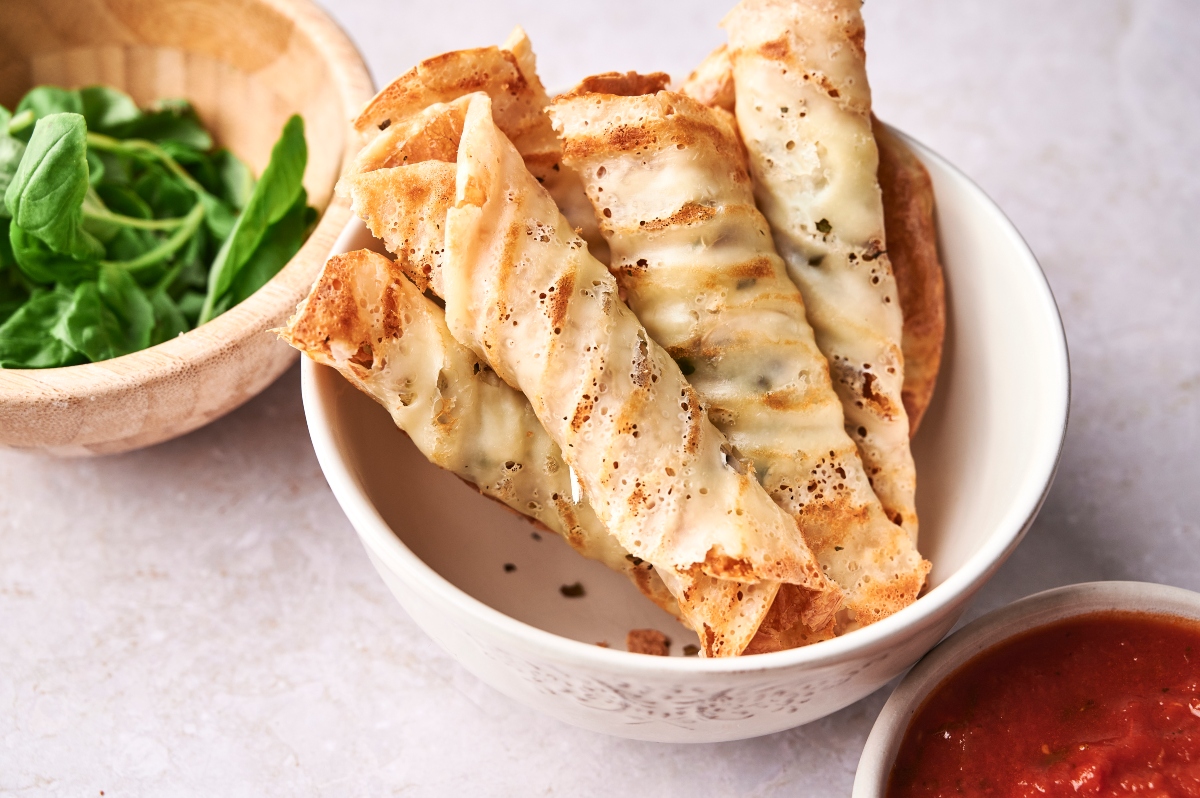 Keto pizza rolls in a white bowl