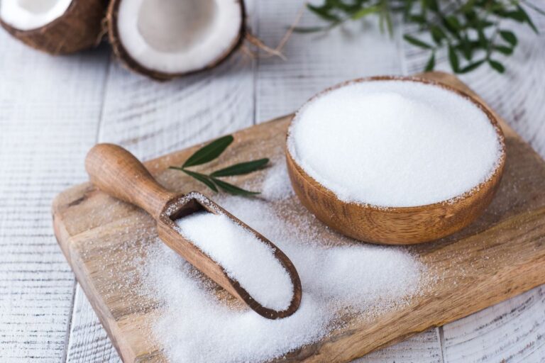 Allulose vs. Erythritol in wooden spoon and bowl