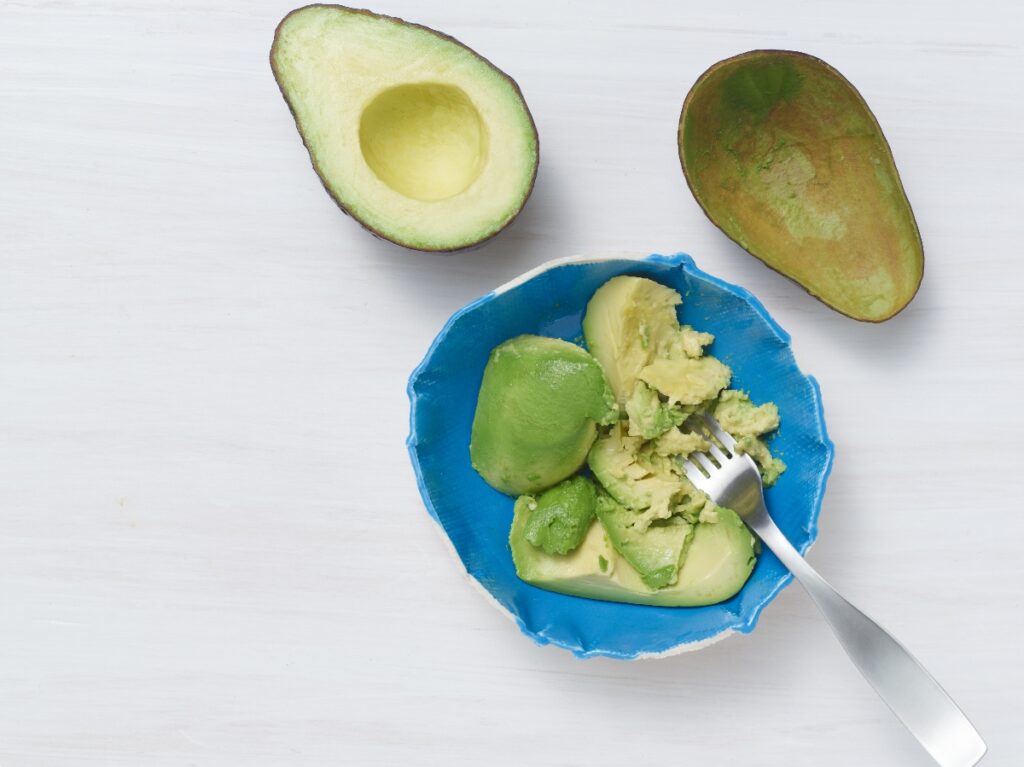 Mashed Avocado in Blue Bowl
