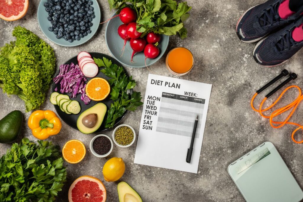 Healthy diet lifestyle concept and weight loss program with fitness equipment and fresh food