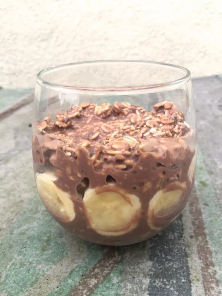 Overnight chocolate protein with banana and cocoa in a glass