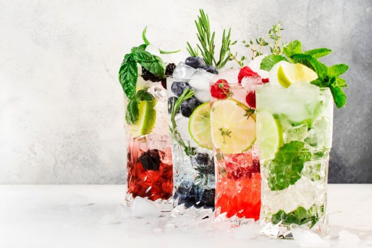 Various low carb moctails on a white table surface